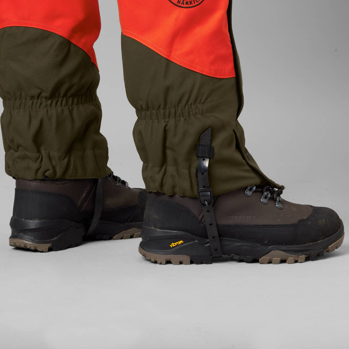 Härkila Wildboar Pro gaiters - Orange blaze/Willow green